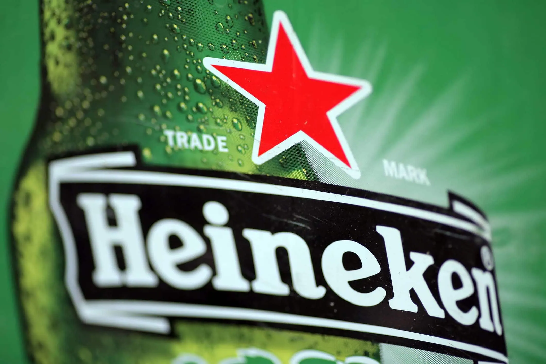 Heineken beer bottle with condensation, emphasizing premium branding and quality for effective brand growth strategies.